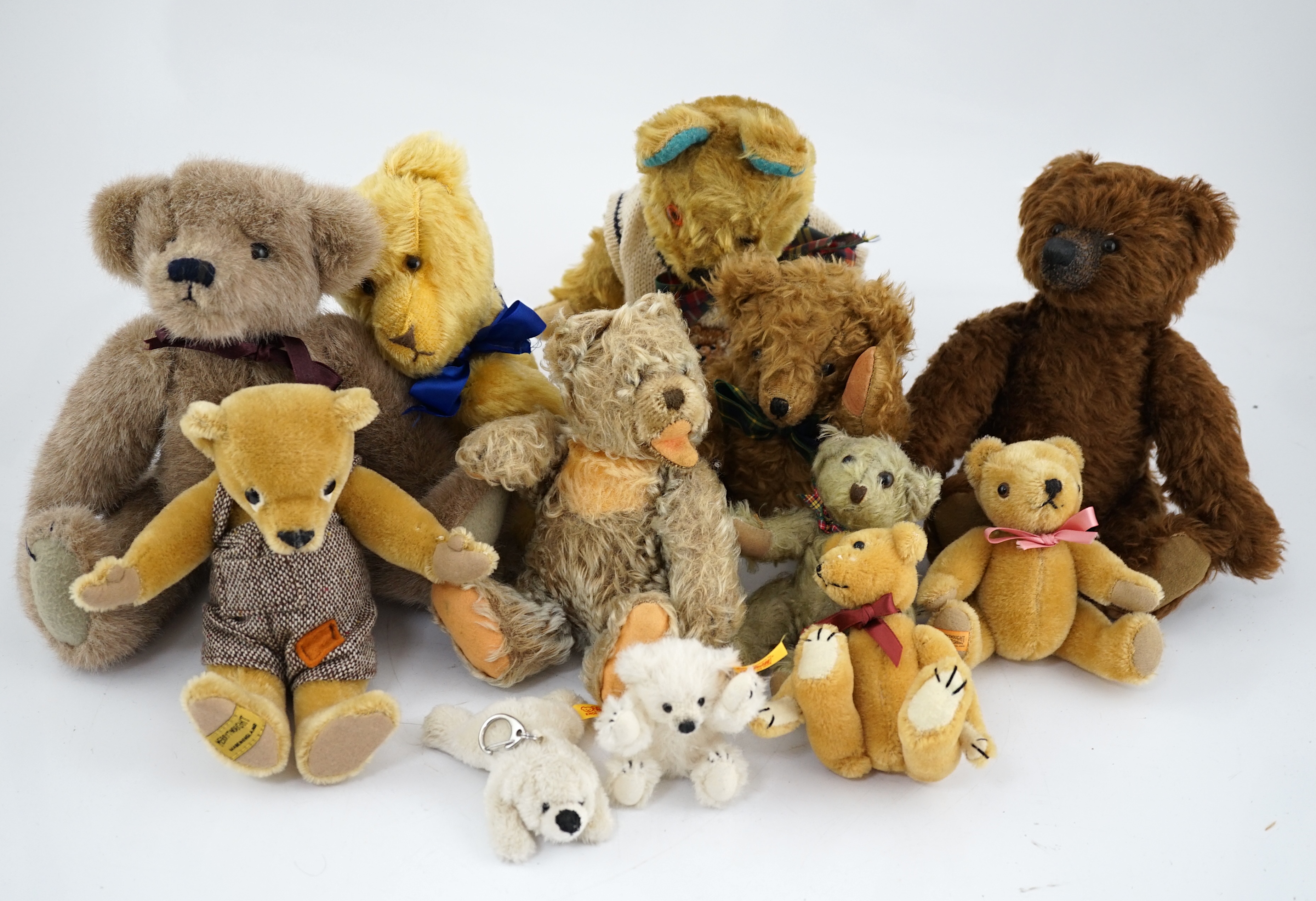 A collection of twenty-six modern teddy bears by The English Teddy Bear Co., Honey Hill Bears, Merrythought, Robin Rive, Steiff, etc.